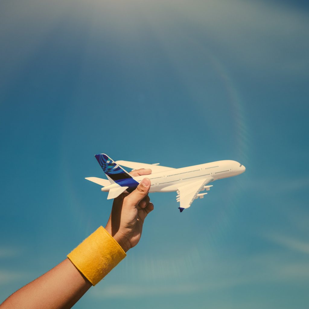 Kid playing with a toy airplane