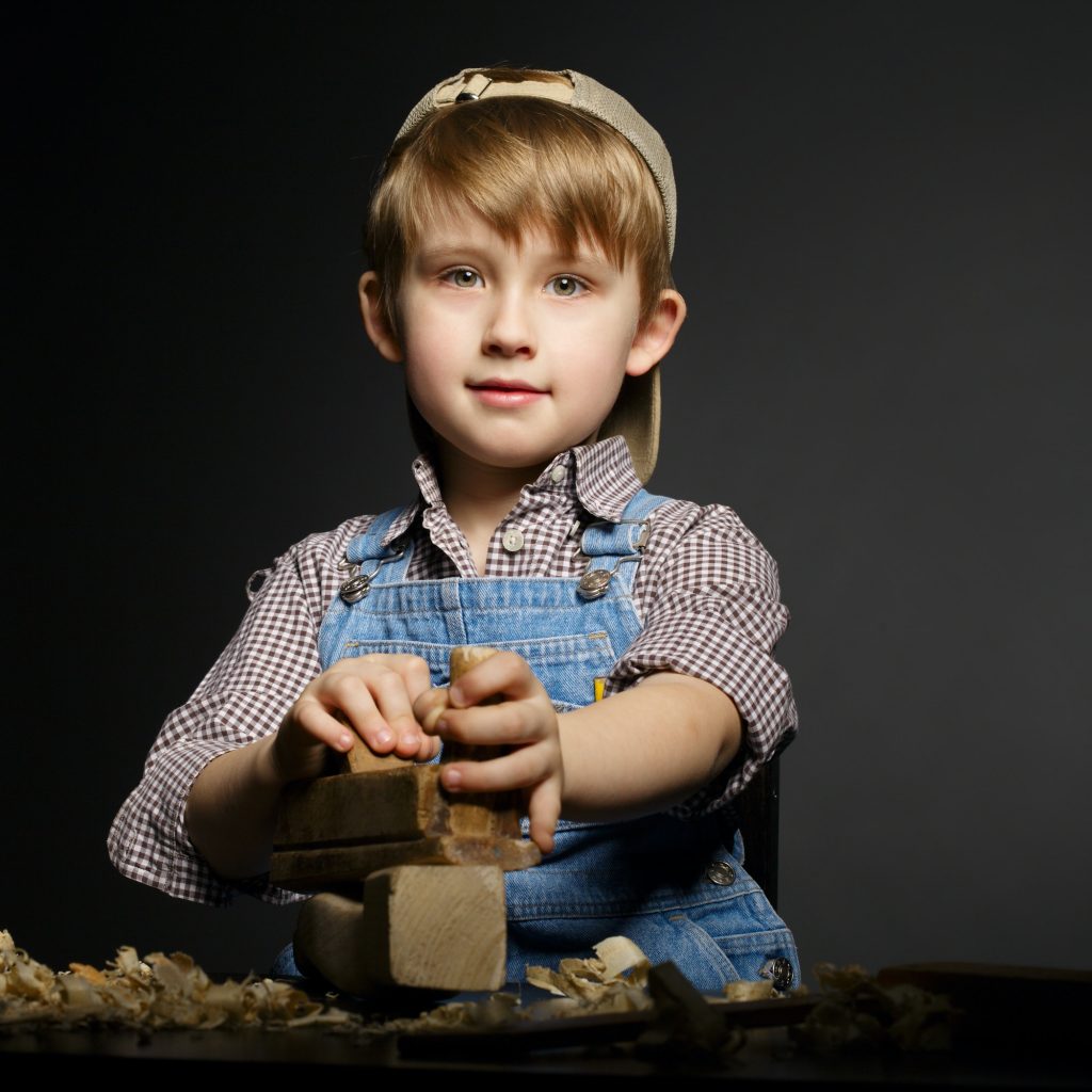 little boy working with plane